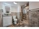 Updated bathroom featuring modern fixtures, stone tile, glass shower, and great lighting at 19429 E 65Th Pl, Aurora, CO 80019