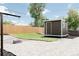 Spacious backyard featuring a shed, a fire pit, and lush green grass at 7918 Raleigh Pl, Westminster, CO 80030