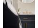 Stylish bathroom features modern vanity with gold hardware and elegant faucet at 7918 Raleigh Pl, Westminster, CO 80030