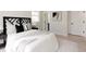 Spacious bedroom with a decorative headboard, luxurious bedding, and bright natural light at 7918 Raleigh Pl, Westminster, CO 80030