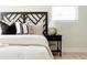 Bedroom boasts a decorative headboard, stylish bedding, and modern bedside table at 7918 Raleigh Pl, Westminster, CO 80030