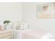 Comfortable bedroom decorated with soft colors and playful art at 7918 Raleigh Pl, Westminster, CO 80030