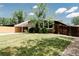 Home with beautiful landscaping and a covered carport provides great curb appeal at 7918 Raleigh Pl, Westminster, CO 80030