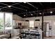 Contemporary kitchen with white cabinets, stainless steel appliances, and a black ceiling at 7918 Raleigh Pl, Westminster, CO 80030