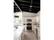 Modern kitchen with white cabinets, stainless steel appliances, and an open design that is bright and airy at 7918 Raleigh Pl, Westminster, CO 80030