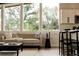 Bright living area features large windows with natural light, modern furniture, and stylish decor at 7918 Raleigh Pl, Westminster, CO 80030