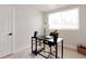 Home office features a modern desk, comfortable chair, and ample natural light at 7918 Raleigh Pl, Westminster, CO 80030