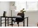 Home office features a modern desk, comfortable chair, and ample natural light at 7918 Raleigh Pl, Westminster, CO 80030