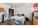 Bedroom features a closet and neutral-toned decor with a comfortable bed at 5995 W Hampden Ave # 13G, Denver, CO 80227