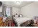 This bedroom has a bed with a gray blanket and 2 pillows at 5995 W Hampden Ave # 13G, Denver, CO 80227