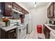 Functional kitchen featuring white appliances, and sleek countertop at 5995 W Hampden Ave # 13G, Denver, CO 80227