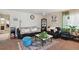 Inviting living room featuring neutral walls, plush sofas, area rug, and natural light at 5995 W Hampden Ave # 13G, Denver, CO 80227