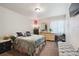 Bright main bedroom with a walk-in closet and an ensuite bathroom at 5995 W Hampden Ave # 13G, Denver, CO 80227