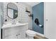 Stylish bathroom featuring modern geometric wallpaper, vanity, and a sleek, updated design at 9675 E Kansas Cir # 45, Denver, CO 80247