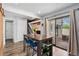 Bright dining area with access to outdoor patio and staircase leading to the upper floor at 9675 E Kansas Cir # 45, Denver, CO 80247
