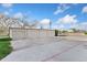 A well-maintained detached garage with multiple bays and concrete driveway at 9675 E Kansas Cir # 45, Denver, CO 80247