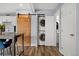 Convenient laundry area with a stackable washer and dryer and sliding barn door access at 9675 E Kansas Cir # 45, Denver, CO 80247