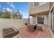 Relaxing outdoor patio featuring a modern fire pit and a fenced yard at 9675 E Kansas Cir # 45, Denver, CO 80247