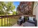 Spacious back deck with outdoor seating overlooking a large yard with lush greenery at 9951 Winona St, Westminster, CO 80031