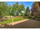 Inviting backyard featuring a spacious deck and lush green lawn, perfect for entertaining at 9951 Winona St, Westminster, CO 80031