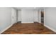 Finished basement featuring wood-look floors, multiple doorways, and freshly painted walls at 9951 Winona St, Westminster, CO 80031