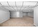 Spacious basement featuring carpeted floor, neutral paint, and drop ceiling at 9951 Winona St, Westminster, CO 80031