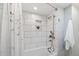 Modern bathroom with white subway tile shower, built in niche, and sleek shower head at 9951 Winona St, Westminster, CO 80031