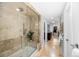 Beautiful stone tile walk-in shower with bench seating and a large walk-in closet at 9951 Winona St, Westminster, CO 80031