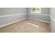Neutral bedroom featuring carpet flooring, white walls, and a single window at 9951 Winona St, Westminster, CO 80031