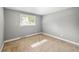 This bedroom has neutral-toned walls, tan carpet, and a window providing natural light at 9951 Winona St, Westminster, CO 80031