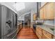 Modern kitchen with stainless steel appliances, granite countertops, and hardwood flooring at 9951 Winona St, Westminster, CO 80031
