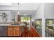 Open-concept kitchen featuring wooden cabinets, granite countertops, and a spacious layout at 9951 Winona St, Westminster, CO 80031