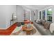 Open-concept living space with hardwood floors, stylish furniture, and plenty of natural light at 9951 Winona St, Westminster, CO 80031
