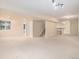 Spacious finished basement with neutral carpet, bar area, and staircase at 6911 Chestnut Ct, Parker, CO 80134