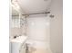 White bathroom featuring shower and tub combo with black hardware and accents at 6911 Chestnut Ct, Parker, CO 80134