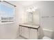 Neat bathroom featuring a vanity with drawers, a large mirror and tile floors at 6911 Chestnut Ct, Parker, CO 80134