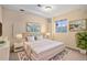 Bedroom with soft lighting, a neutral color scheme, and a large window at 6911 Chestnut Ct, Parker, CO 80134