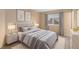 Cozy bedroom featuring neutral walls, soft carpet, and a comfortable bed with stylish bedding at 6911 Chestnut Ct, Parker, CO 80134