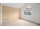 This is an empty bedroom with a large window and neutral walls awaiting your personal touches at 6911 Chestnut Ct, Parker, CO 80134