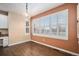 Dining room featuring hardwood floors and lots of natural light from large windows at 6911 Chestnut Ct, Parker, CO 80134