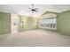 Large main bedroom features a tray ceiling, a ceiling fan, and an en suite bathroom at 6911 Chestnut Ct, Parker, CO 80134