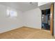Finished basement space with a window, carpeting, and neutral-toned walls at 3022 Blackhawk St, Aurora, CO 80011