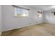 Bedroom with beige carpet, white walls, and natural light from multiple windows at 3022 Blackhawk St, Aurora, CO 80011