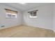 Bright room with two windows letting in lots of natural light at 3022 Blackhawk St, Aurora, CO 80011