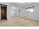 A light-filled bedroom with a window and neutral-toned walls at 3022 Blackhawk St, Aurora, CO 80011
