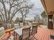 Back deck with an outdoor table and seating and a view of the neighborhood at 7016 Reed St, Arvada, CO 80003