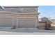 Attached two car garage showcasing ample parking and storage space at 21210 E Radcliff Pl, Aurora, CO 80015