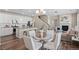 Open layout integrating the kitchen, dining area, and living room, ideal for modern living and entertaining at 21210 E Radcliff Pl, Aurora, CO 80015