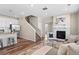 Bright living space with modern kitchen, cozy fireplace, and comfortable seating, perfect for relaxing or entertaining at 21210 E Radcliff Pl, Aurora, CO 80015