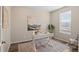 Bright home office with a white desk, decor, neutral walls, wood-look floors, and lots of natural light at 21210 E Radcliff Pl, Aurora, CO 80015